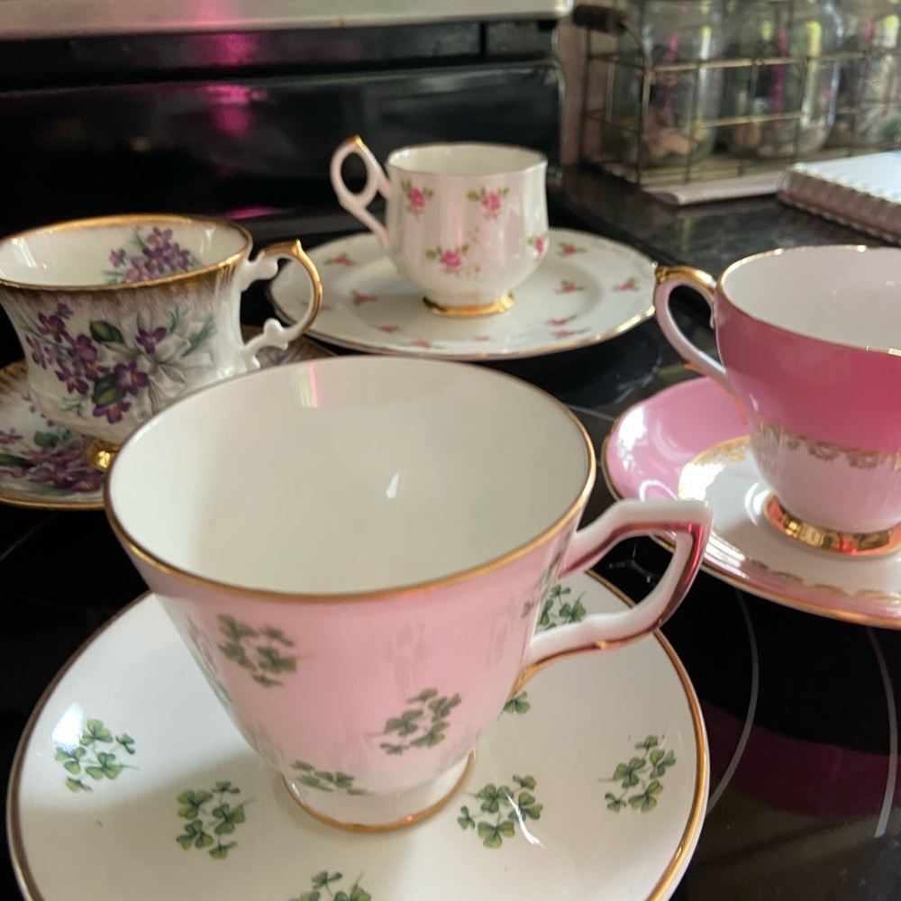 4 beautiful tea cups and saucers .